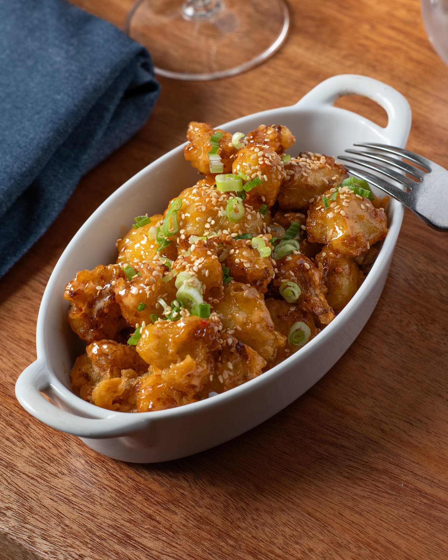 Firecracker cauliflower with sweet chili aioli and sesame