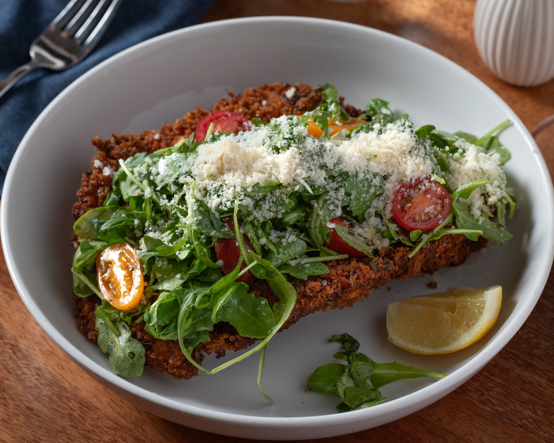 Brined chicken Milanese with arugula and parmigiana