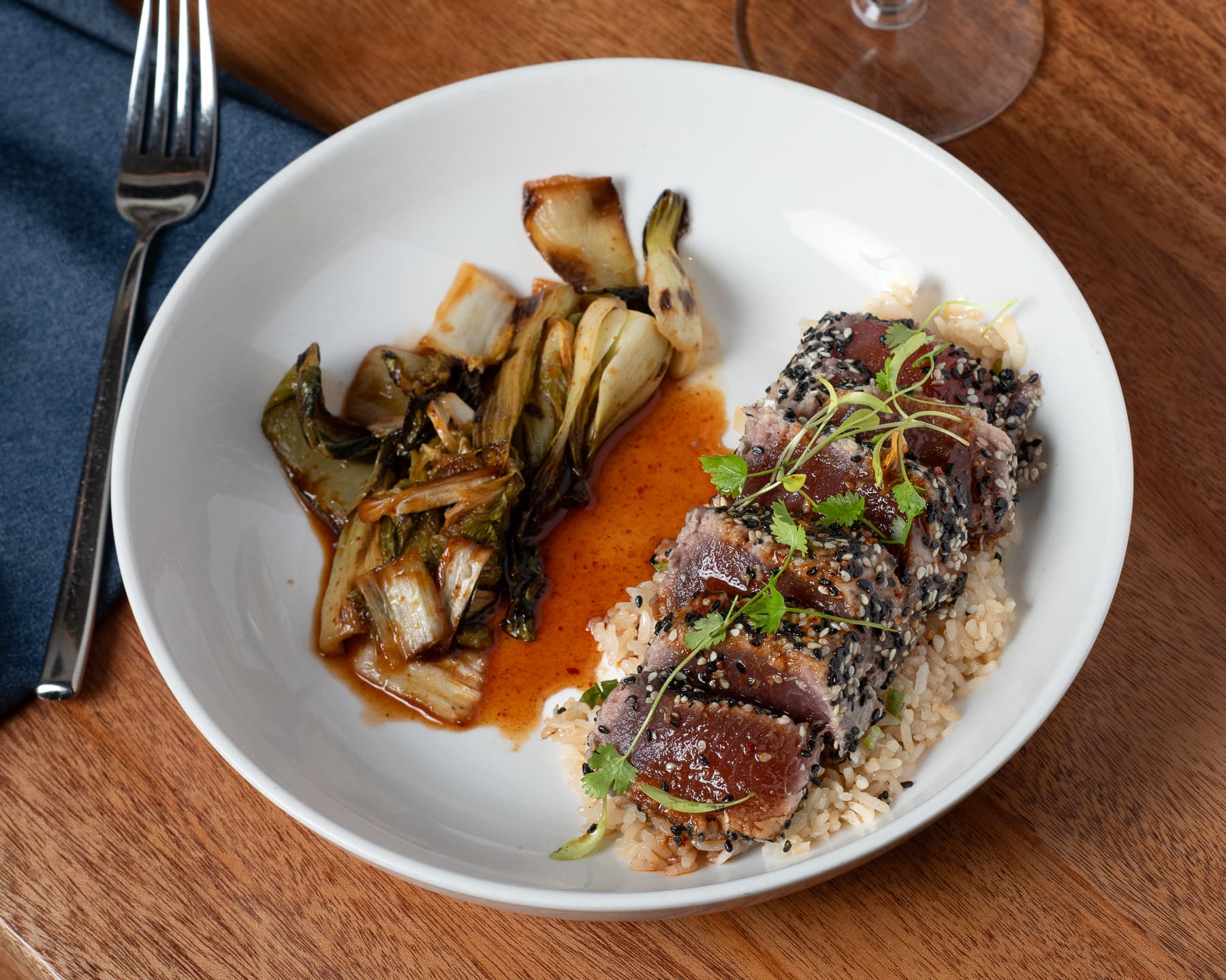 Sesame seared tuna with rice, bok choy, and kimchi glaze